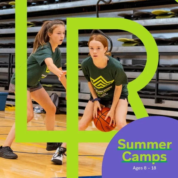 Two girls play basketball with the RDP logo overlayed