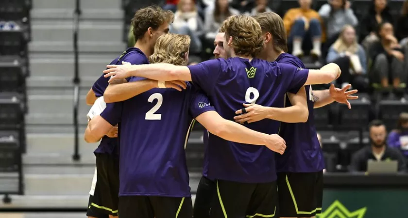 Kings Volleyball starting XI huddle during match