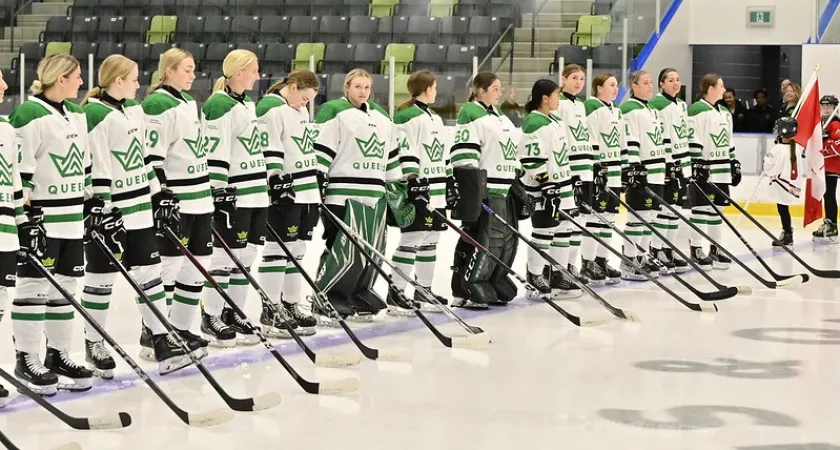 Queens Hockey roster standing on blueline for O Canada