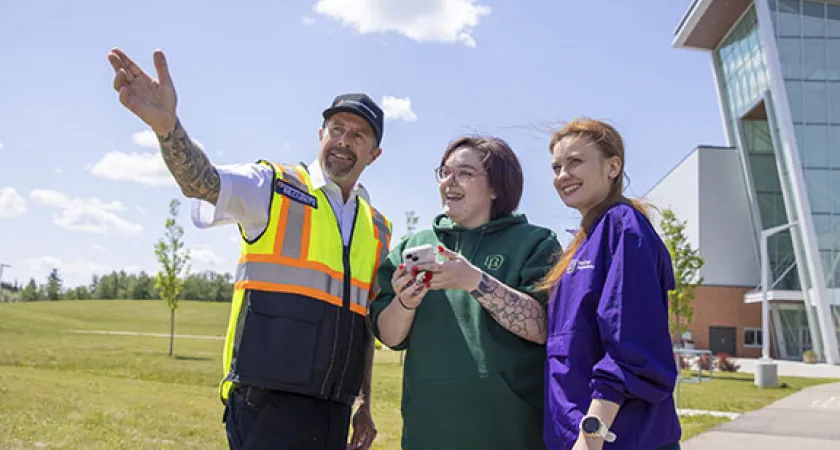 Security Services team member provides directions to students