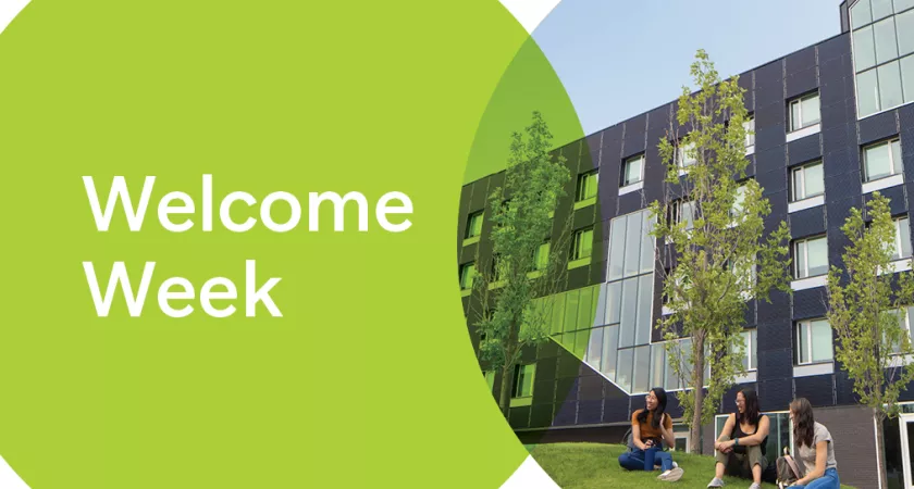 A group of students sit on the grass in front of the new residence building. Text on screen reads "Welcome Week"