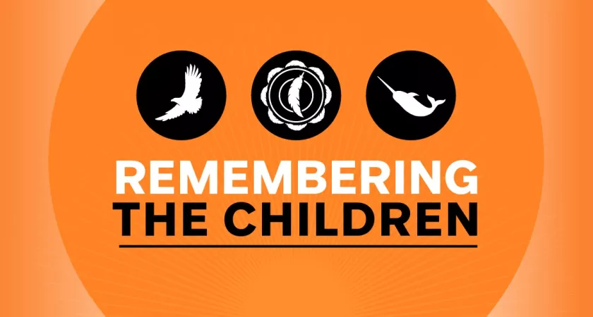 On an orange background are the words Remembering the Children. Above the text are three icons in black circles - an eagle in flight, a feather on a beaded flower, and a narwhale.