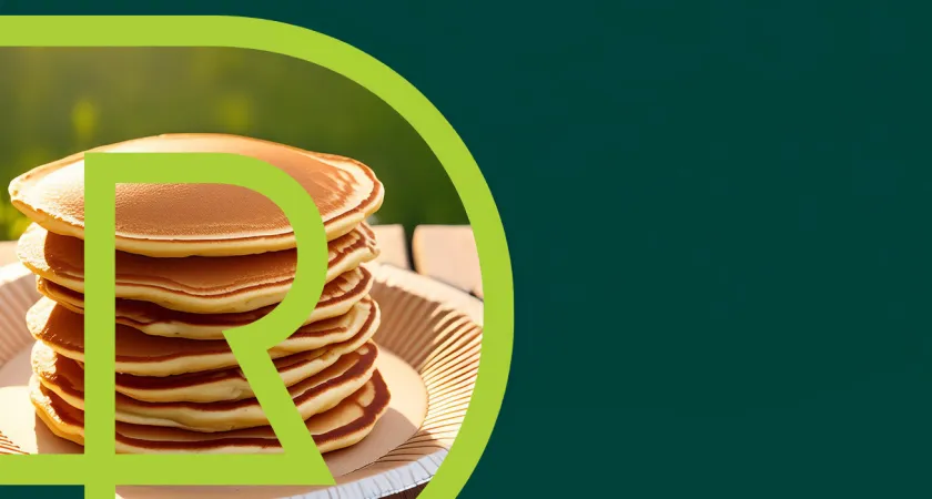 A stack of delicious looking pancakes on a paper plate with the RDP logo overlayed on top