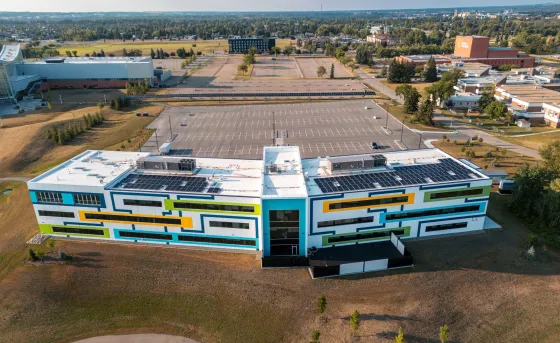 an aerial shot looking down at the multi-coloured CACAC building called the Sheldon Kennedy Centre of Excellence