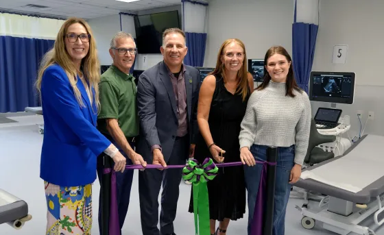 Members of RDP's executive team and Sonography program cutting the ribbon at new lab