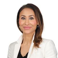Smiling headshot of Ms. Melina Dharma-Wardene on a white background