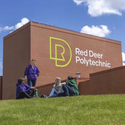 group of friends sitting in front of RDP logo