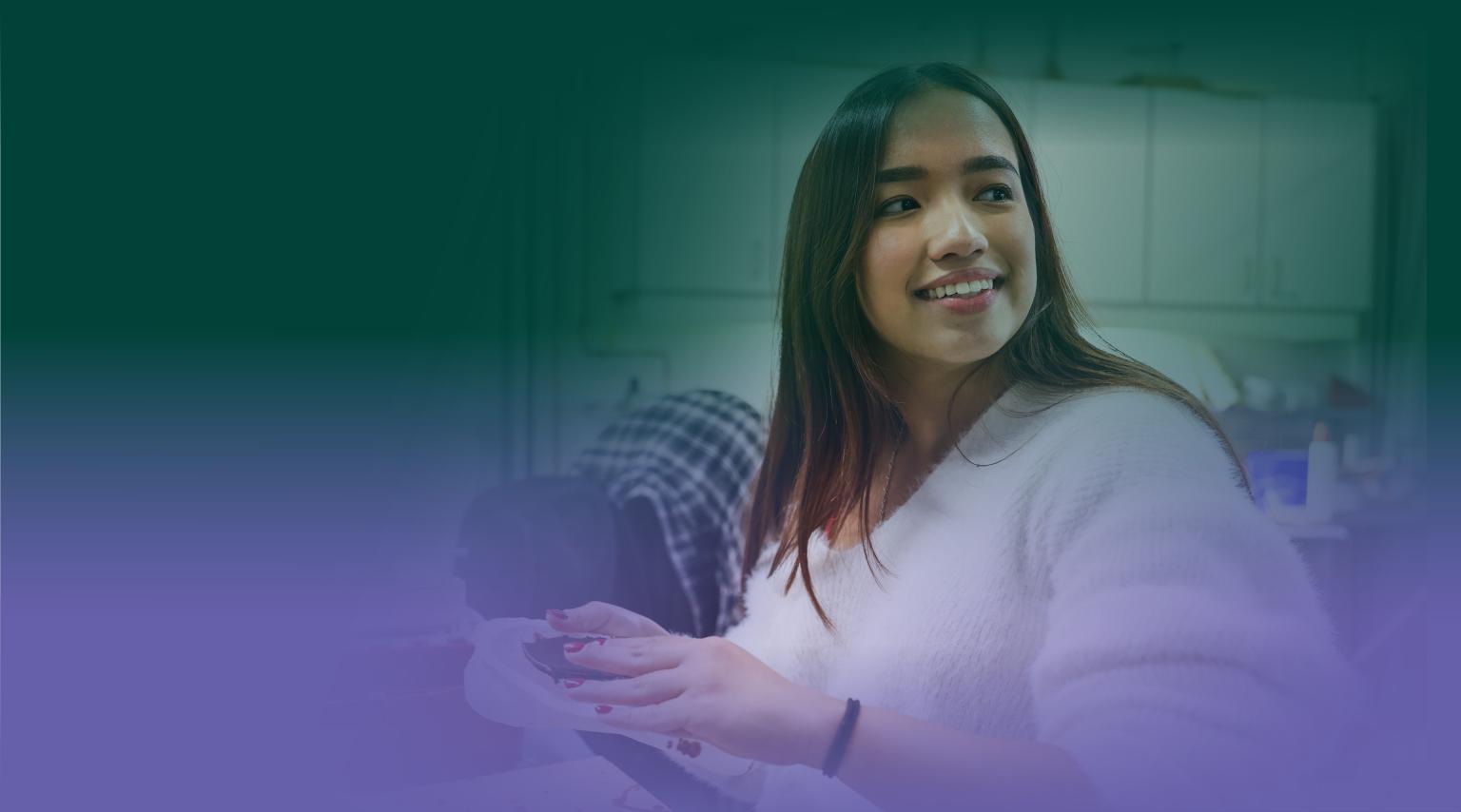 A smiling woman looks just off screen with RDP colours creating a gradient overtop.