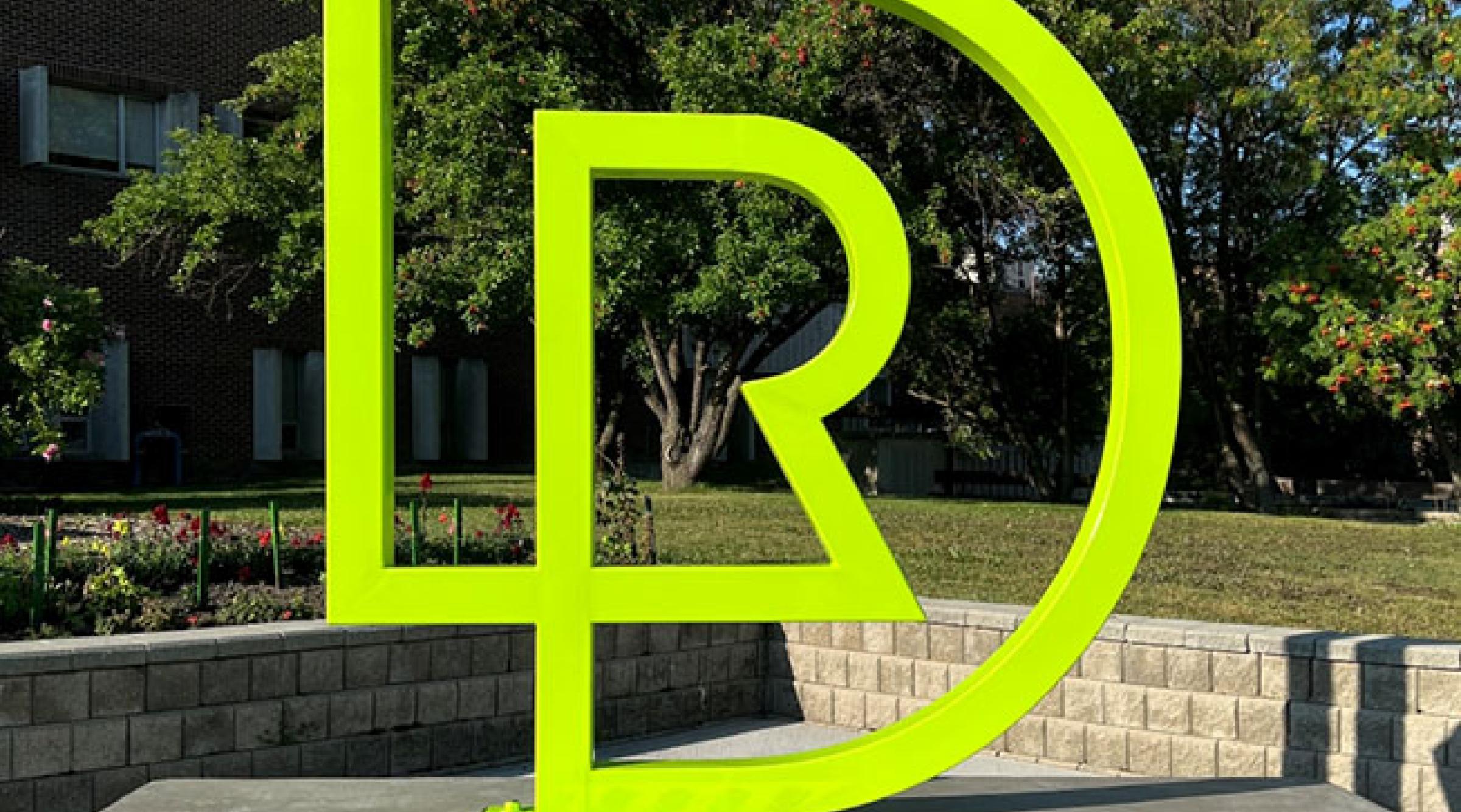 RDP Logo monogram in front of college