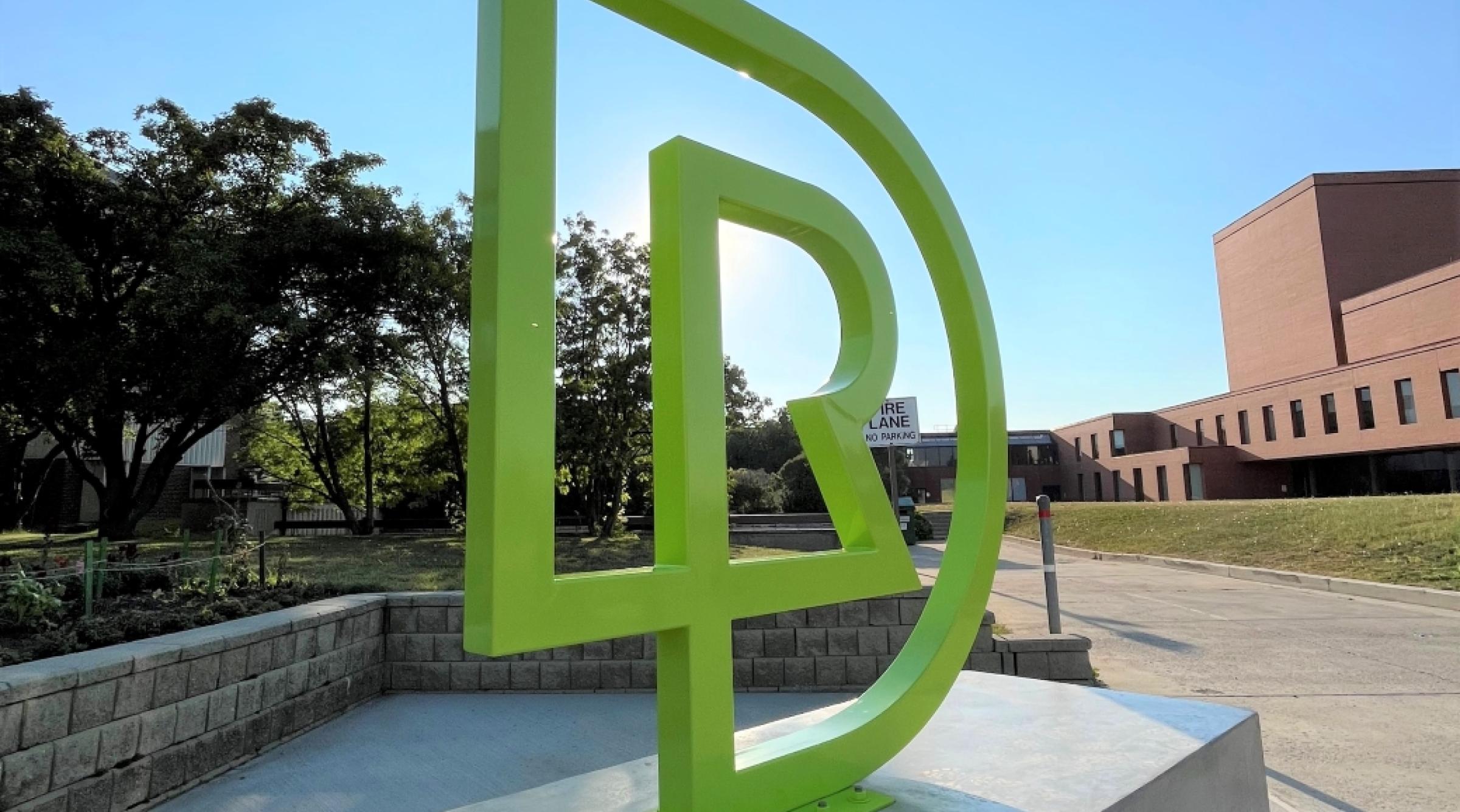 RDP monogram in front of school