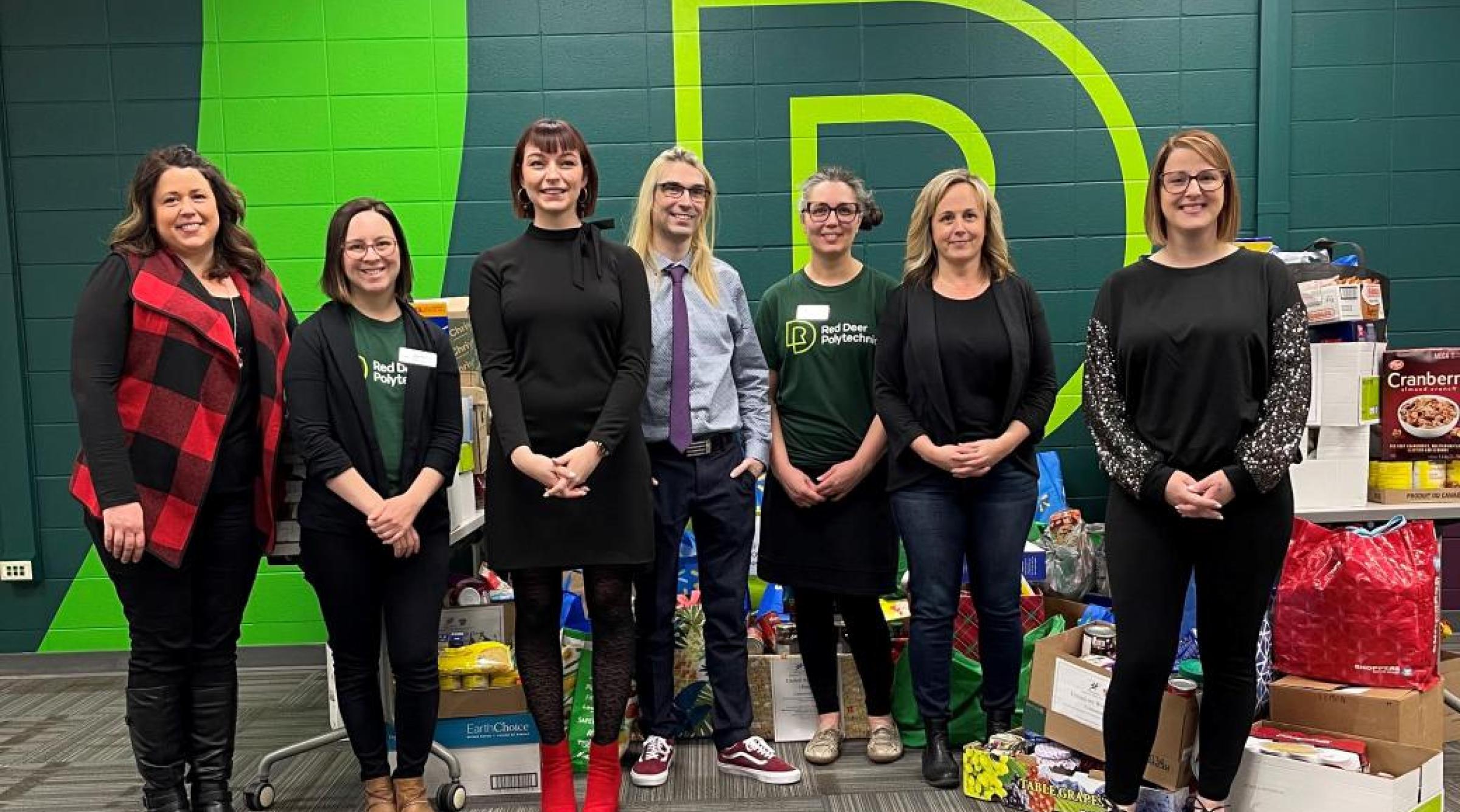 Employees from across RDP pose for a picture in front of the food donated