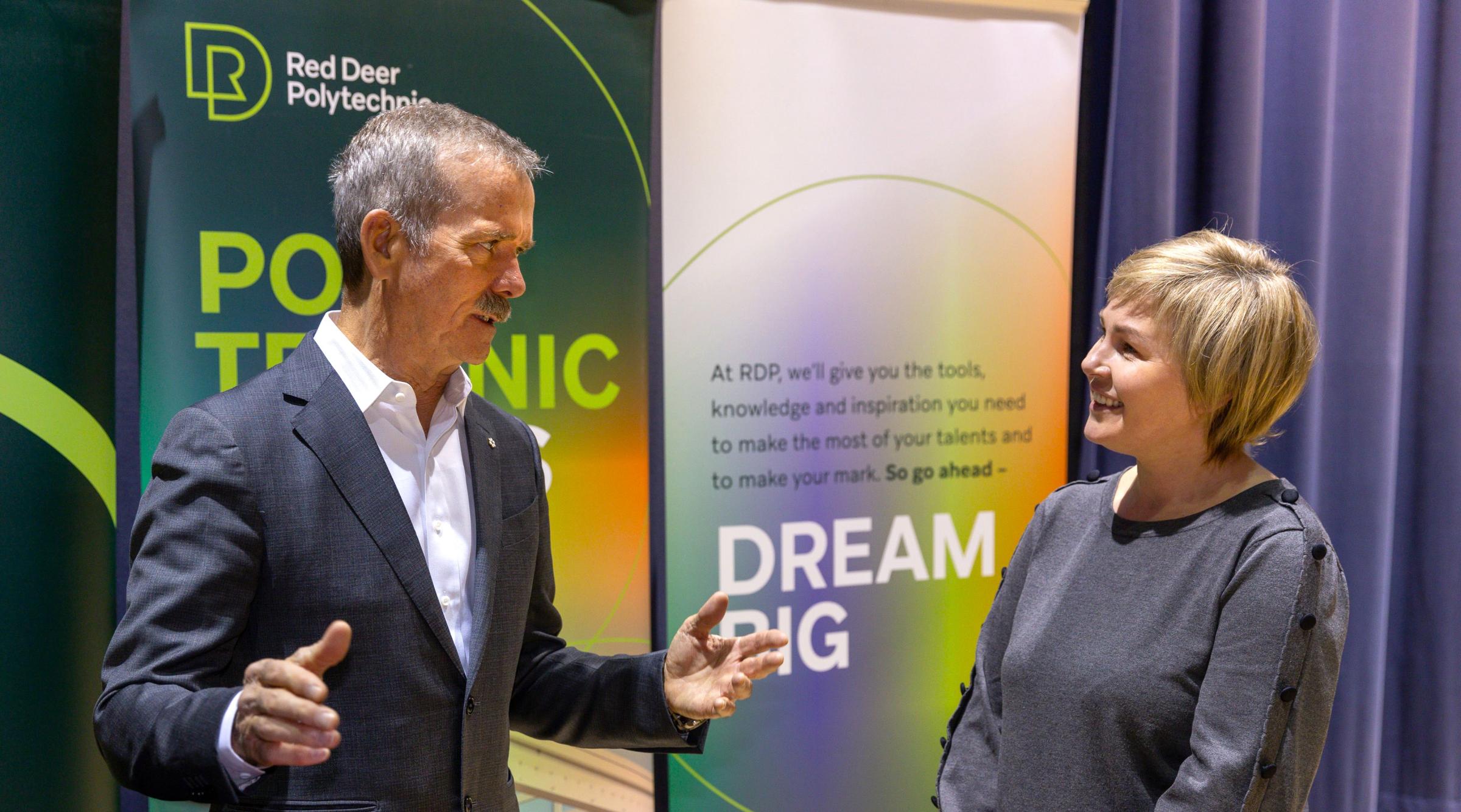 Chris Hadfield talking with attendee at Perspectives student session
