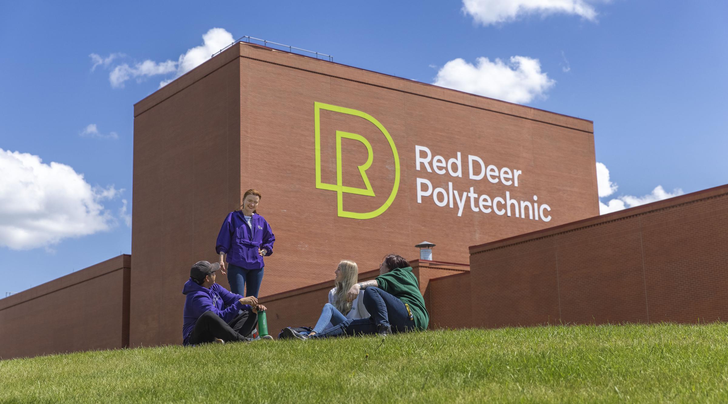 group of friends sitting in front of RDP logo