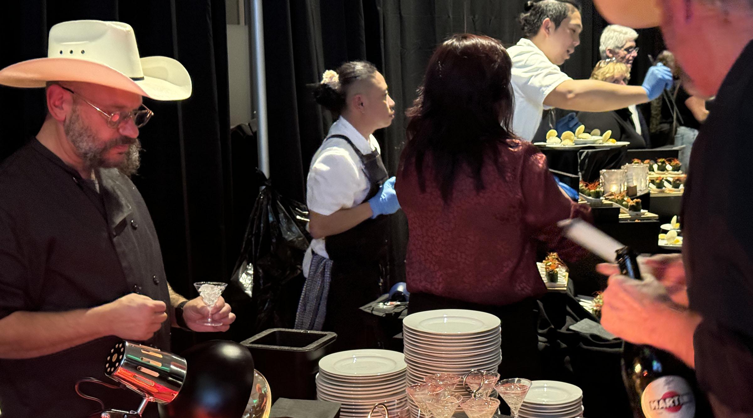 A guest enjoys food and beverage samples at Red Deer Polytechnic's event Palate: A Taste of Local