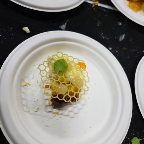 A dish created by Lauren Milne featuring intricate honeycomb decorations
