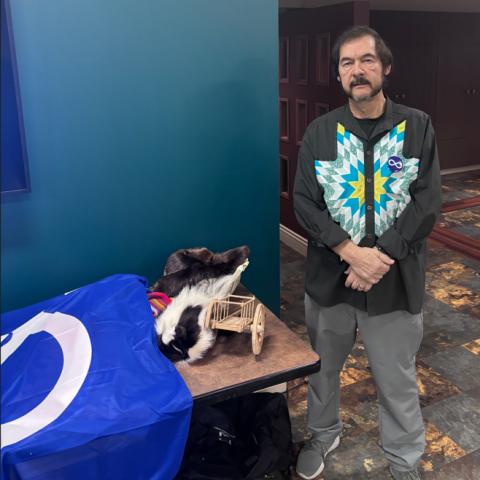 Brian St. Germain stands beside a table of Metis cultural items at RDP