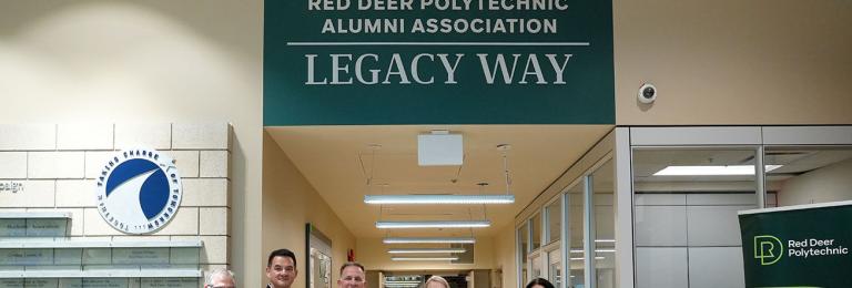 Representatives from RDP and the Alumni Association cut a ribbon to celebrate the opening of Red Deer Polytechnic Alumni Legacy Way on main campus 