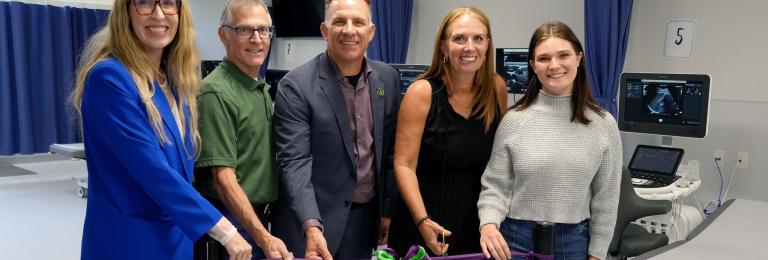 Members of RDP's executive team and Sonography program cutting the ribbon at new lab