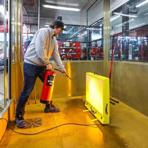 Student putting out a fire