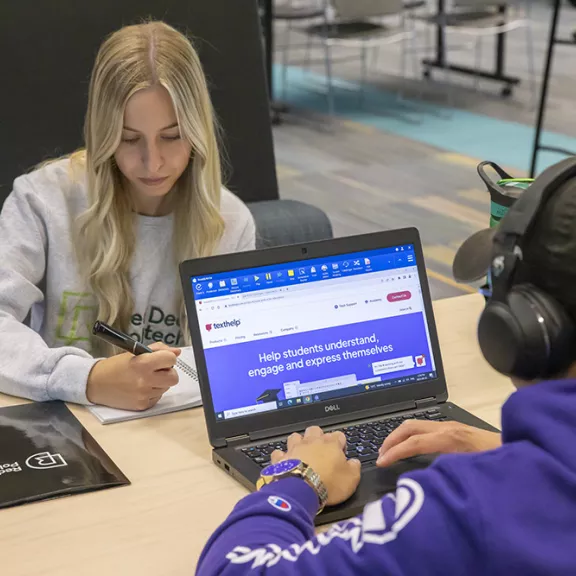 two RDP students studying in Library