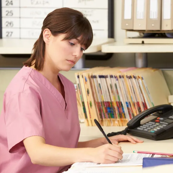 Woman working in a medical office.